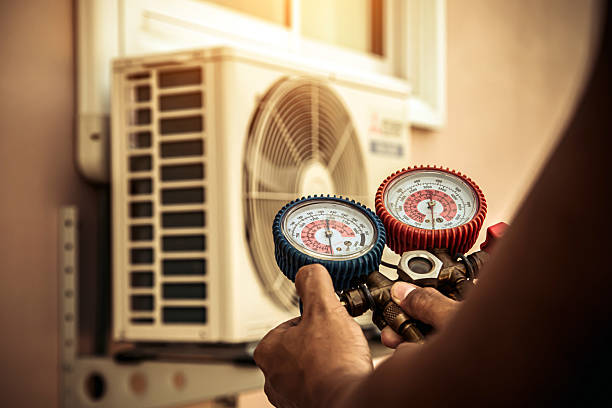 Professional Ac Installation technician working in Pella, IA